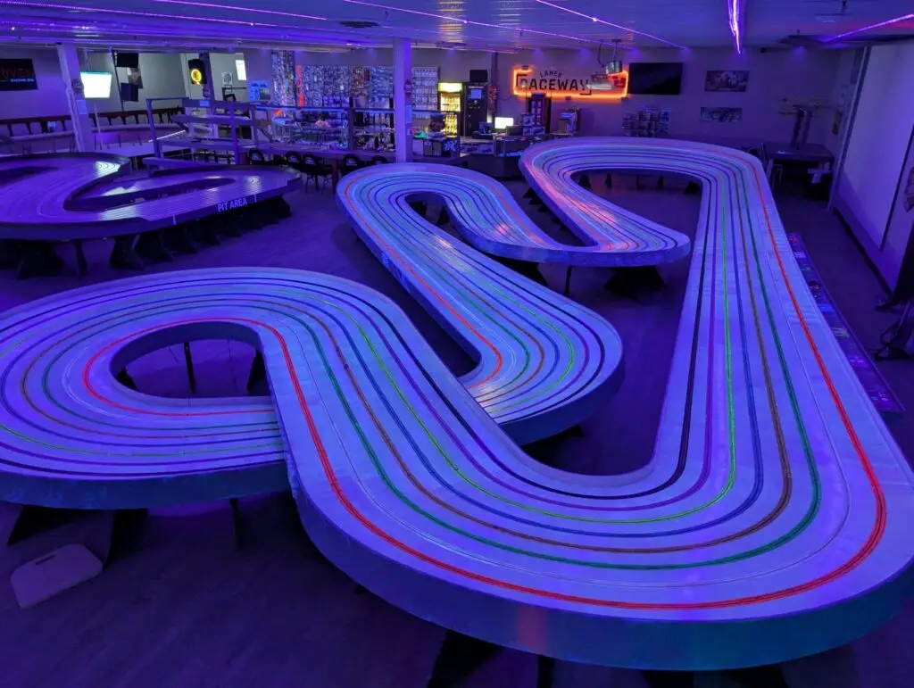The Frost King track glowing under black light at Lanes Raceway